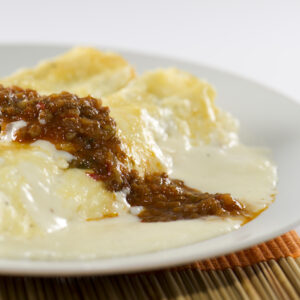 Canelones de Carne - 1 porción individual ( 2rollitos) con salsa blanca